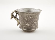 Wine cup with ring handle, birds, animals, and grape vines, Early Tang dynasty, late 7th century. Creator: Unknown.