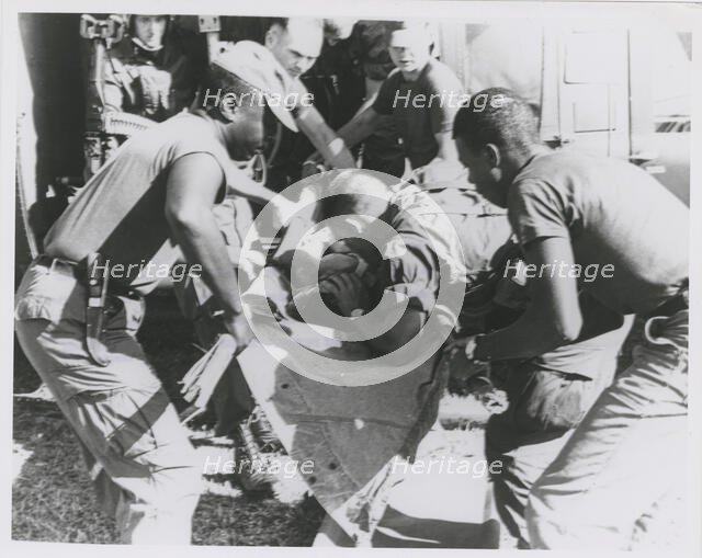 Paratrooper from the 101st Airborne Brigade applying mouth-to-mouth resuscitation..., 1967. Creator: United States Army.