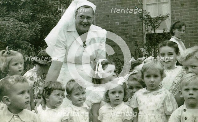 Matron Joan Gardner and children at St Monan's Hospital, 1952. Creator: Unknown.