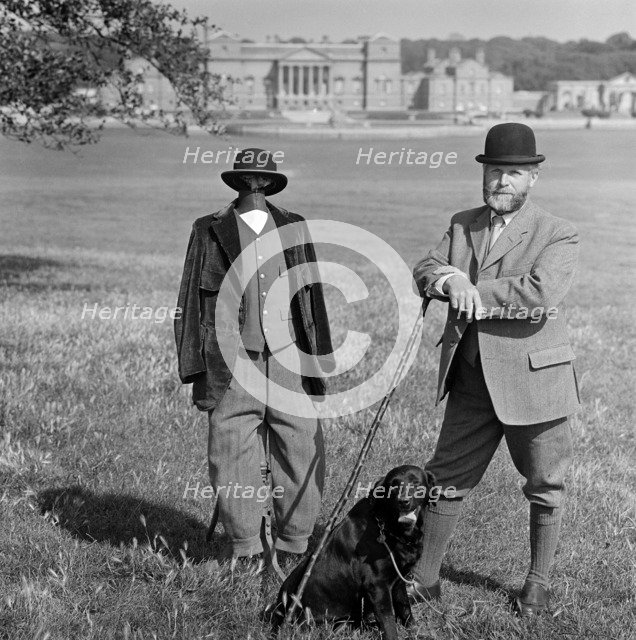 Man in breeches with a dog and a mannequin, Holkham Hall, Norfolk, 1978-1981. Artist: John Gay