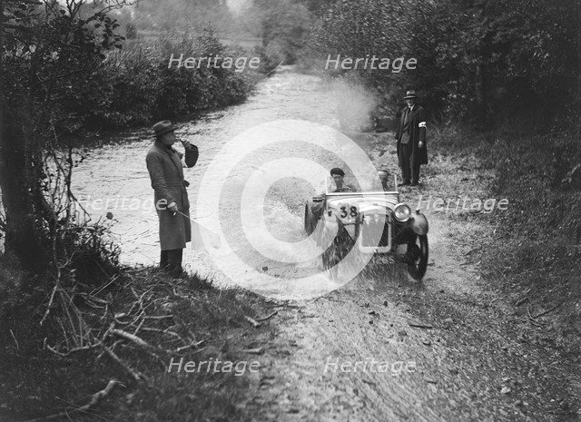 Austin Ulster competing in the JCC Lynton Trial, 1932. Artist: Bill Brunell.