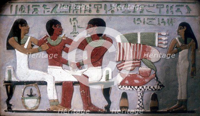 Relief of Imn-Hat seated with his wife & son in front of an offering, Thebes, c2050-c1786 BC. Artist: Unknown