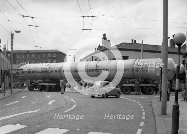 A heavy load stops the Manchester traffic, 1962.  Artist: Michael Walters