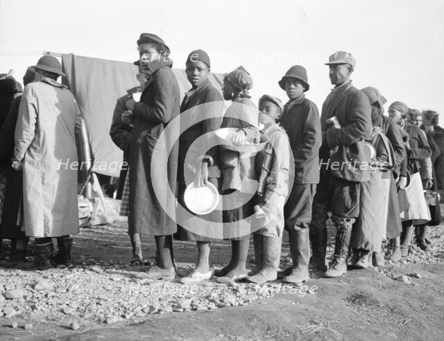Negroes waiting for food in the Forrest City, Arkansas, concentration camp, 1937. Creator: Walker Evans.