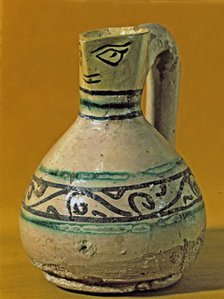 Vase with scoop anthropomorphic shaped decorated in green and black. Manresa pottery discovered i…
