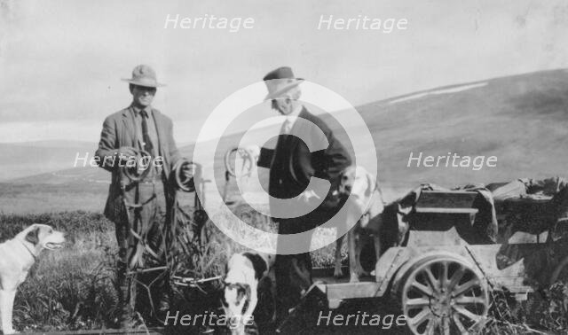 Frank G. Carpenter beside pupmobile, between c1900 and 1916. Creator: Unknown.