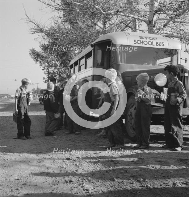 The children from Dead Ox Flat get off bus at school yard, Ontario, Oregon, 1939. Creator: Dorothea Lange.