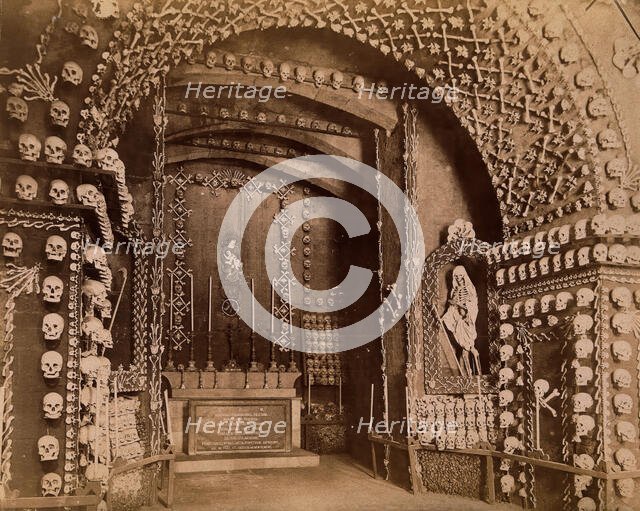 An altar bearing a Latin inscription surrounded by an array of human skulls and bones and..., 1881. Creator: John Edmund Taylor.