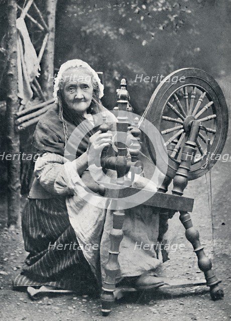 An old Irish woman at her spinning-wheel, 1912. Artist: W Lawrence.