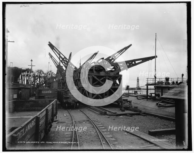 Unloading ore from whaleback, Buffalo, c1900. Creator: Unknown.