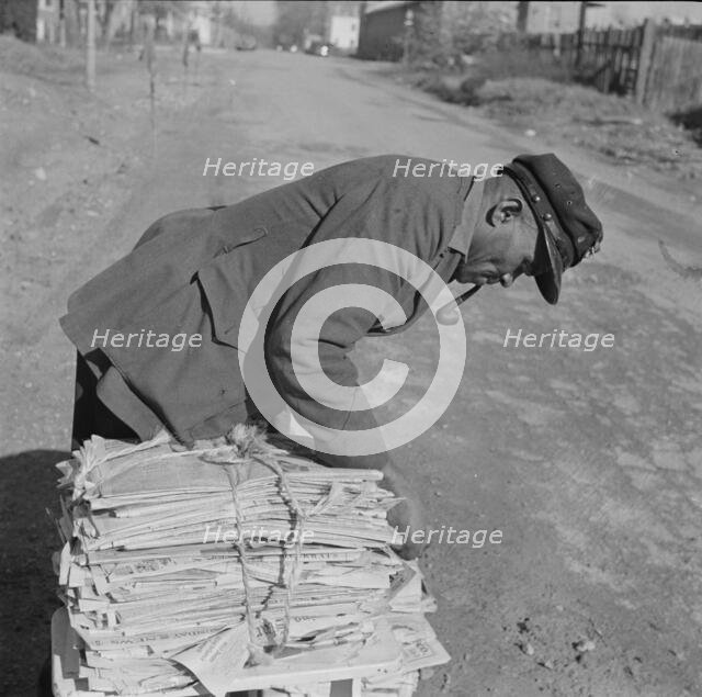 Mr. Venus Alsobrook, official salvage collector for the government, Washington, D.C., 1942. Creator: Gordon Parks.