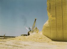 Loading sulphur from vat, Freeport Sulphur Co., Hoskins Mound, Texas, 1943. Creator: John Vachon.
