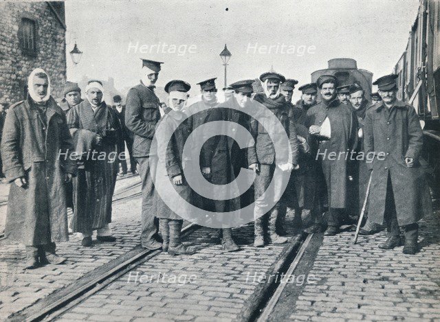 A batch of Neuve Chapelle wounded on a French railway station, 1915. Artist: Unknown