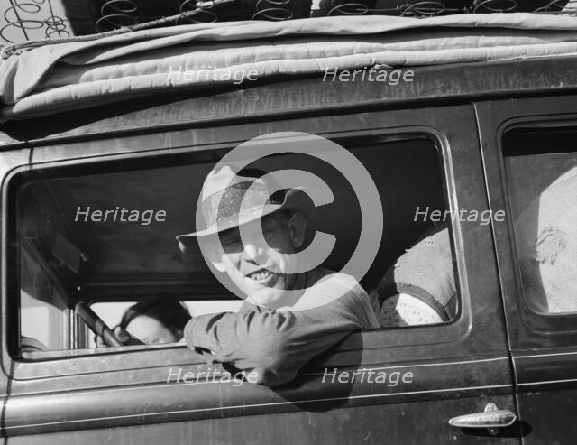 Farmer from Independence, Kansas, on the road at cotton chipping time, U.S. 99, California, 1939. Creator: Dorothea Lange.