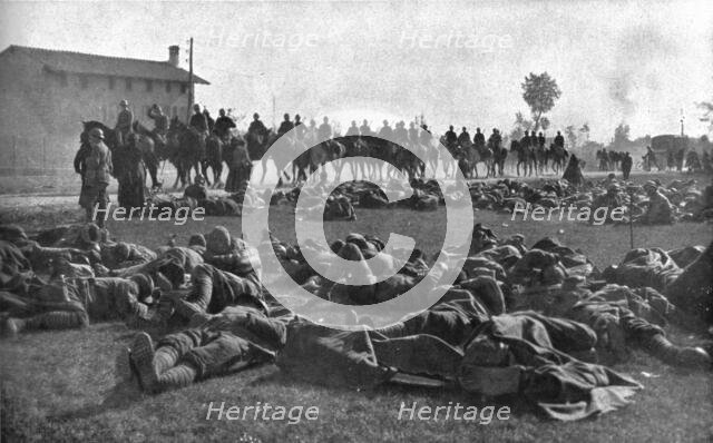 The Dark Hours of Italy; Detachment of infantry, exhausted, resting under protection... 1917. Creator: Unknown.