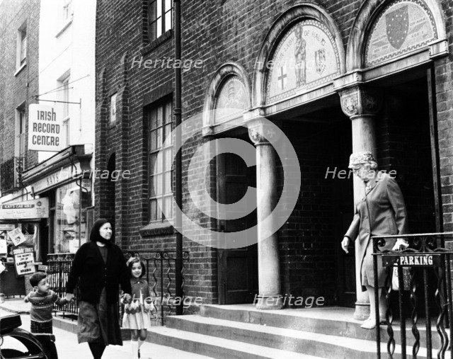 Boys playing on an old car, north London, c1965. Artist: Henry Grant