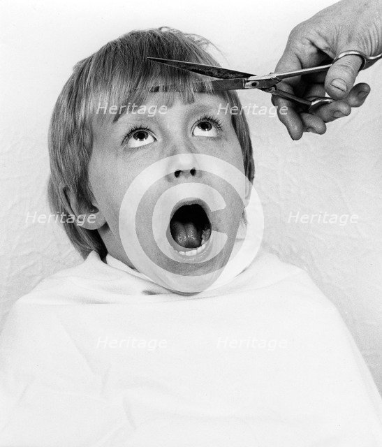 Boy having a haircut, 1988.