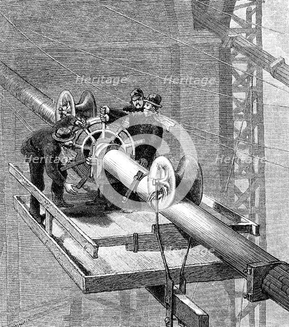 Putting wire wrapping around the suspension cables, Brooklyn Suspension Bridge, 1883. Artist: Unknown