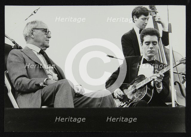 Benny Goodman watching Phil Flanigan and Chris Flory, Knebworth, Hertfordshire, 1982. Artist: Denis Williams