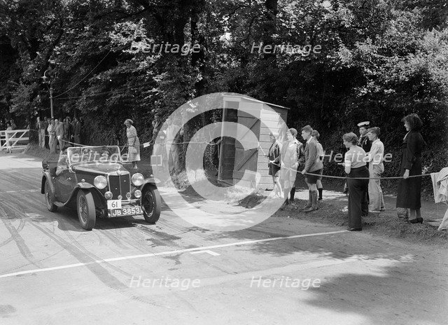 FE Ainley's MG Magnette NA, winner of a bronze award at the MCC Torquay Rally, July 1937. Artist: Bill Brunell.