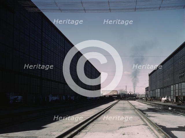A completely overhauled engine on the transfer table at the Atchison, Topeka..., New Mexico., 1943. Creator: Jack Delano.