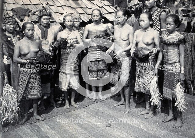 Sarawak: Sea Dayak men at a head feast, c1900. Creator: Unknown.