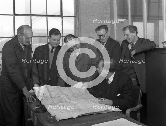 A group of foundry staff with technical drawings, Sheffield, South Yorkshire, 1963. Artist: Michael Walters