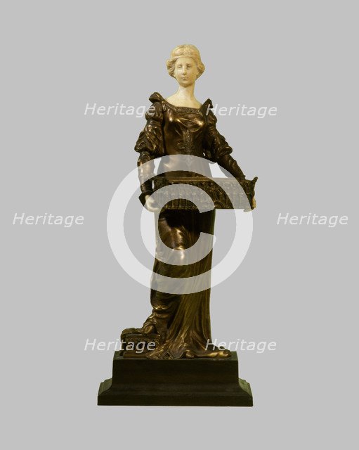 Seated female figure in bronze and ivory.