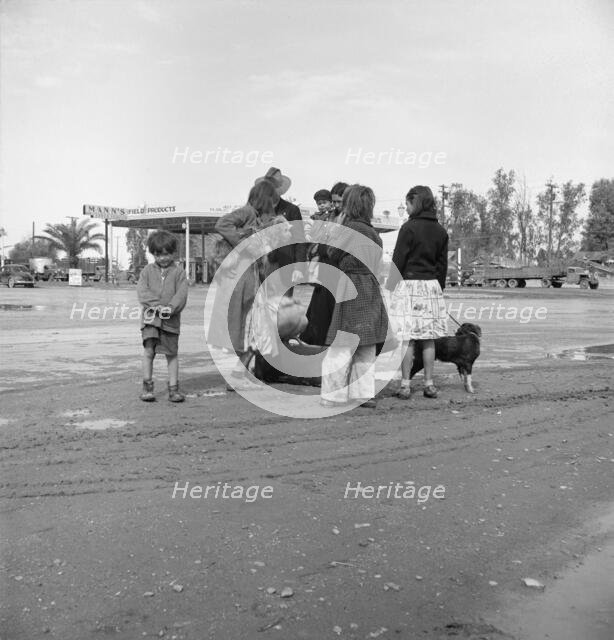 Family of homeless, walking people are left at the edge of the next town, 1939. Creator: Dorothea Lange.