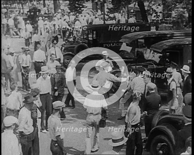 Police Officers Confronting Protesting Soldiers  To Disperse the Army Veterans, 1932. Creator: British Pathe Ltd.
