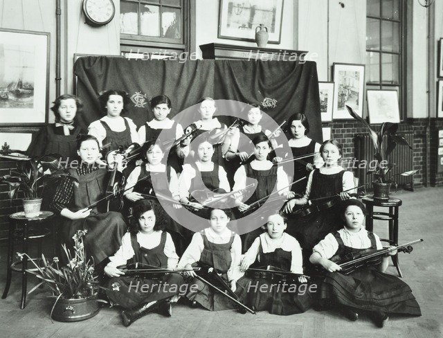 Girls swimming championship team with their shield, Tollington Park Central School, London, 1915. Artist: Unknown.