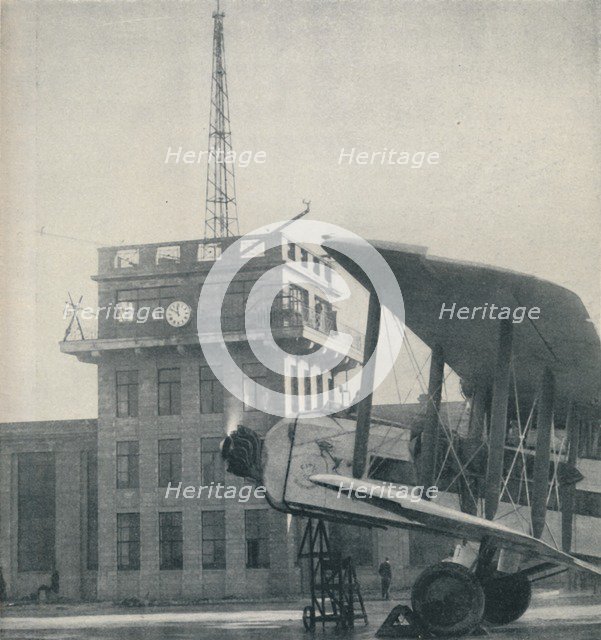 'Where Officers of a Great Aerodrome Keep Contact with the Flying Pilots', c1935. Artist: Unknown.