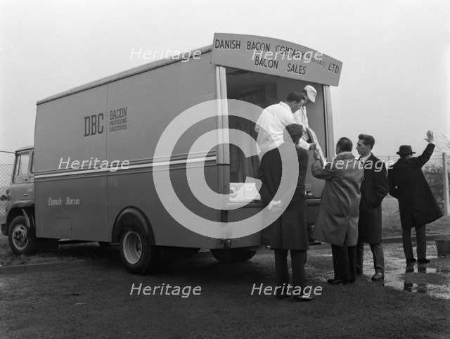Traders buying bacon direct from a Danish Bacon wholesale van, Kilnhurst, South Yorkshire, 1961. Artist: Michael Walters