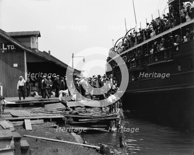 D. & C. [Detroit & Cleveland Navigation Co.] steamer at dock, Cheboygan, Mich., c1900-1910. Creator: Unknown.
