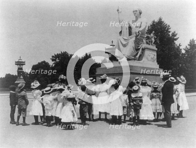 African American school children facing the Horatio Greenough statue of George Washing..., (1899?). Creator: Frances Benjamin Johnston.