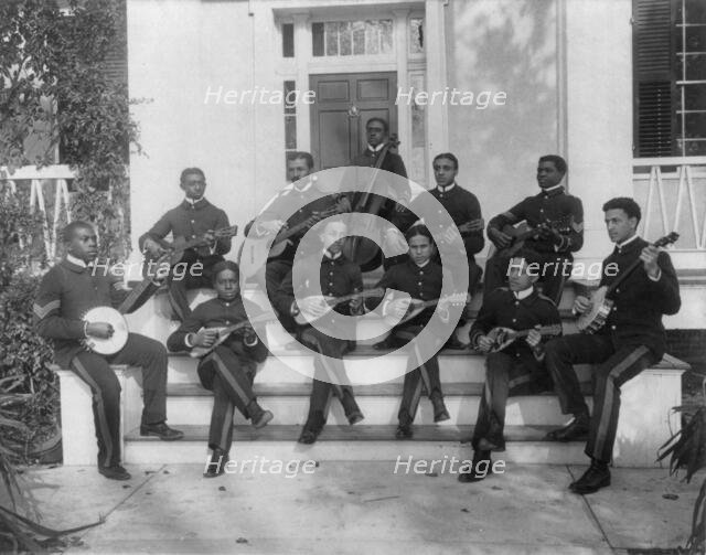 Hampton Institute, Hampton, Va., ca. 1898 - 11 students in uniform playing guitars..., 1899 or 1900. Creator: Frances Benjamin Johnston.