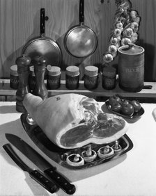 Danish Bacon gammon joint with spice jars, 1963.  Artist: Michael Walters