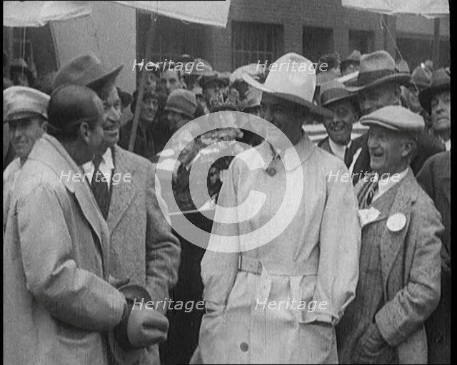 Silent Movie Stars Douglas Fairbanks, Will Rogers, and Tom Mix Posing for the Camera With..., 1921. Creator: British Pathe Ltd.