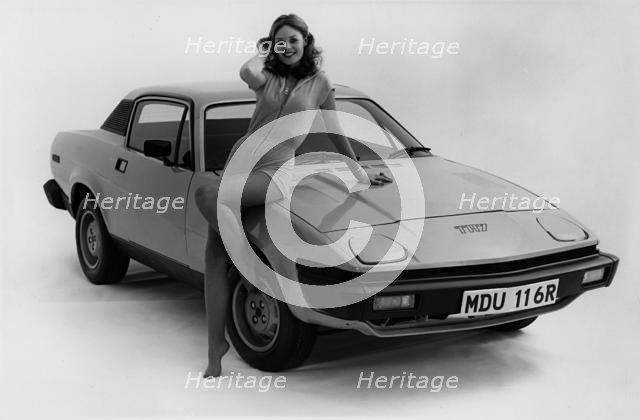 1976 Triumph TR7 with female model. Creator: Unknown.