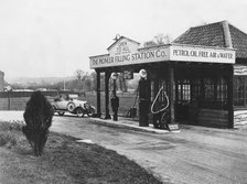 1923 Calcott 10hp at petrol station. Creator: Unknown.