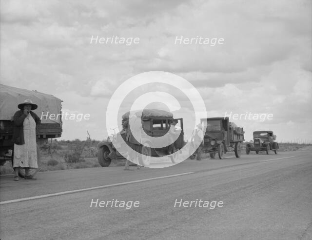 Three related drought refugee families from Oklahoma on highway near Lordsburg, New Mexico, 1937. Creator: Dorothea Lange.