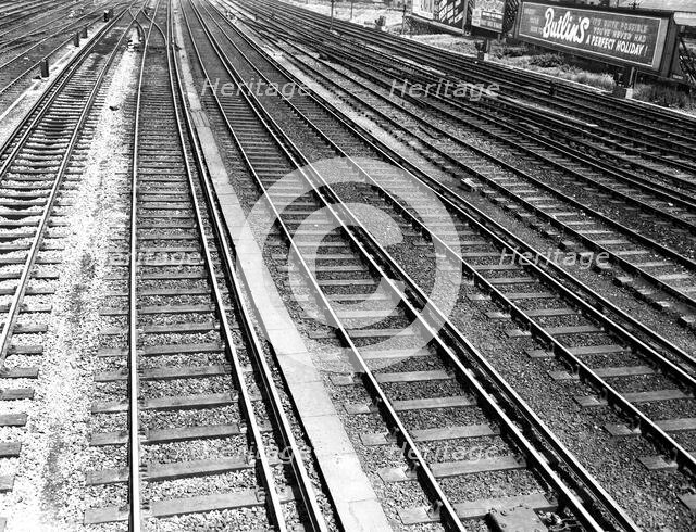 Railway tracks and Butlin's advertisement, c1955. Creator: Arthur Charles Kirby Ware.