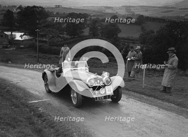 Jaguar SS 100 of Mrs V Hetherington competing in the South Wales Auto Club Welsh Rally, 1937 Artist: Bill Brunell.
