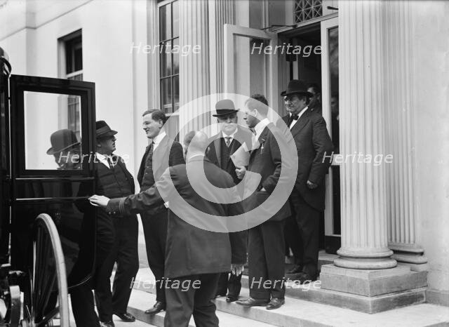 Franklin K. Lane, With Paper in Hand, in Crowd of Newsmen, 1914. Creator: Harris & Ewing.