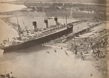 'The White Star Liner Majestic entering the world's largest graving dock at Southampton', c1934, (19 Artist: Unknown.