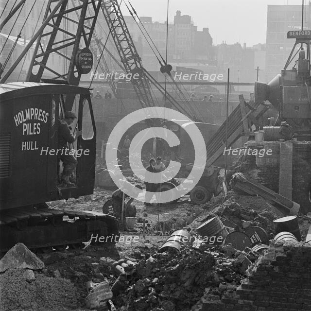 A crane at work on the post-war redevelopment of the Barbican Estate, London, 1962-1964. Creator: John Gay.
