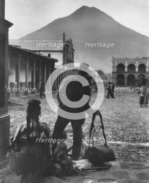 Plaza and volcano of Antigua, Guatemala, between 1899 and 1926. Creator: Arnold Genthe.