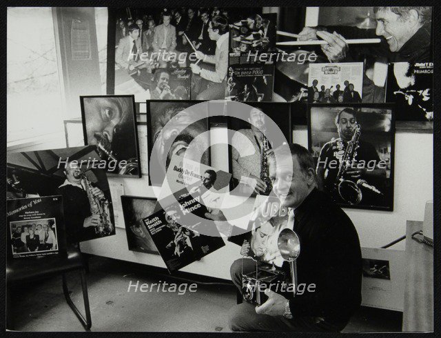 Photographer Denis Williams holding an LP cover. Artist: Unknown
