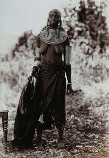 A young Masai woman, full length, wearing much jewellery, 1900. Creator: Unknown.
