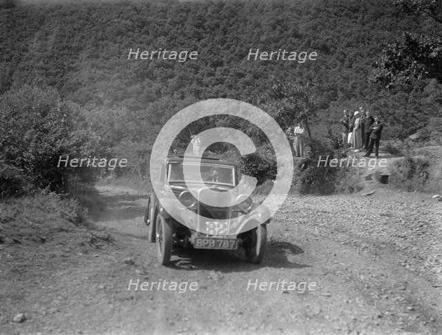 Singer 9 sports saloon competing in the Mid Surrey AC Barnstaple Trial, Beggars Roost, Devon, 1934. Artist: Bill Brunell.